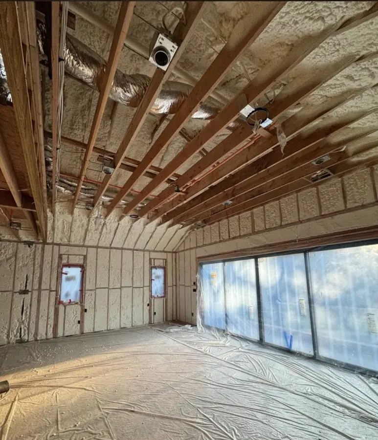 Interior walls and ceiling insulated with spray foam during new construction in Dryden